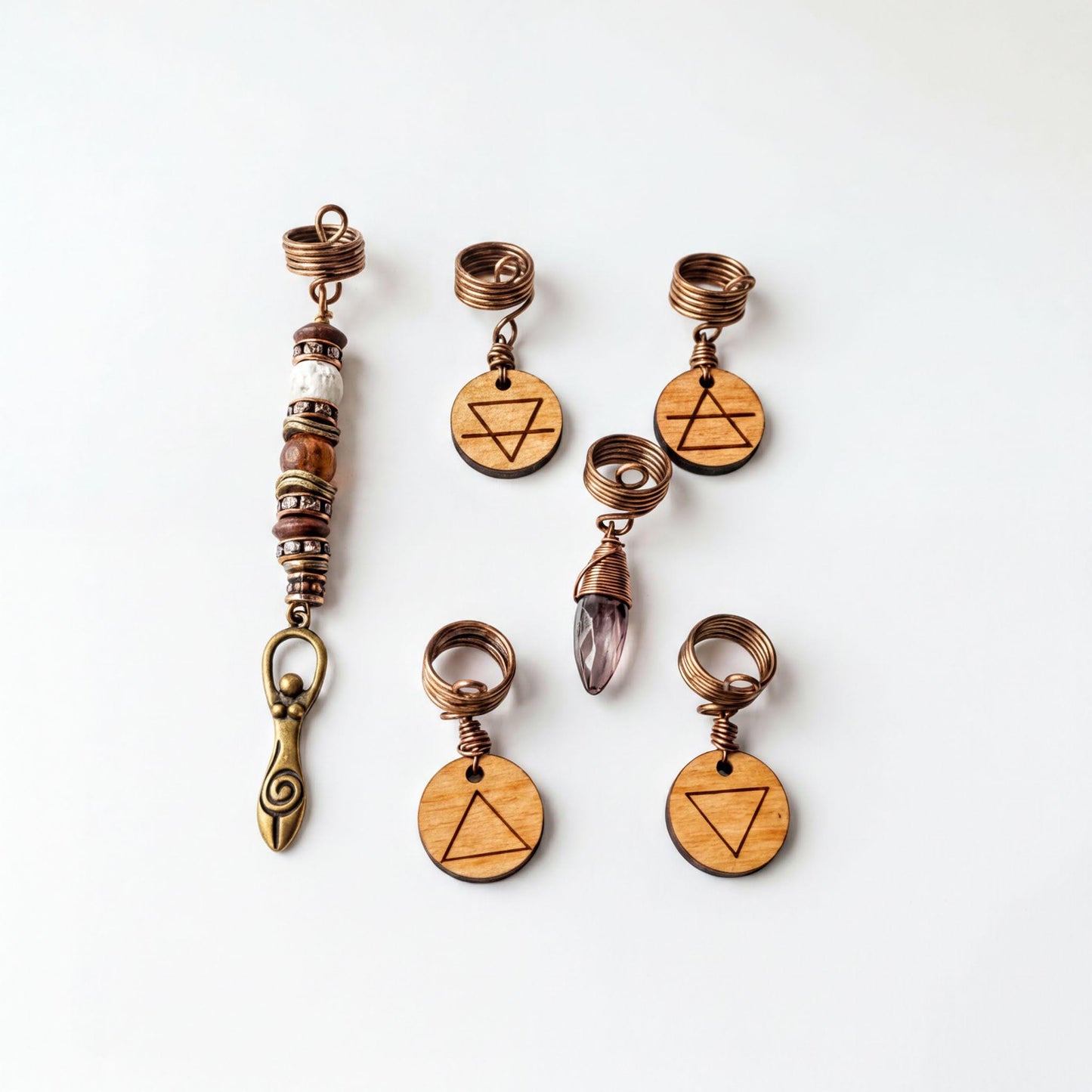a collection of six wooden charms and five metal pendants, each with a unique design and symbol.