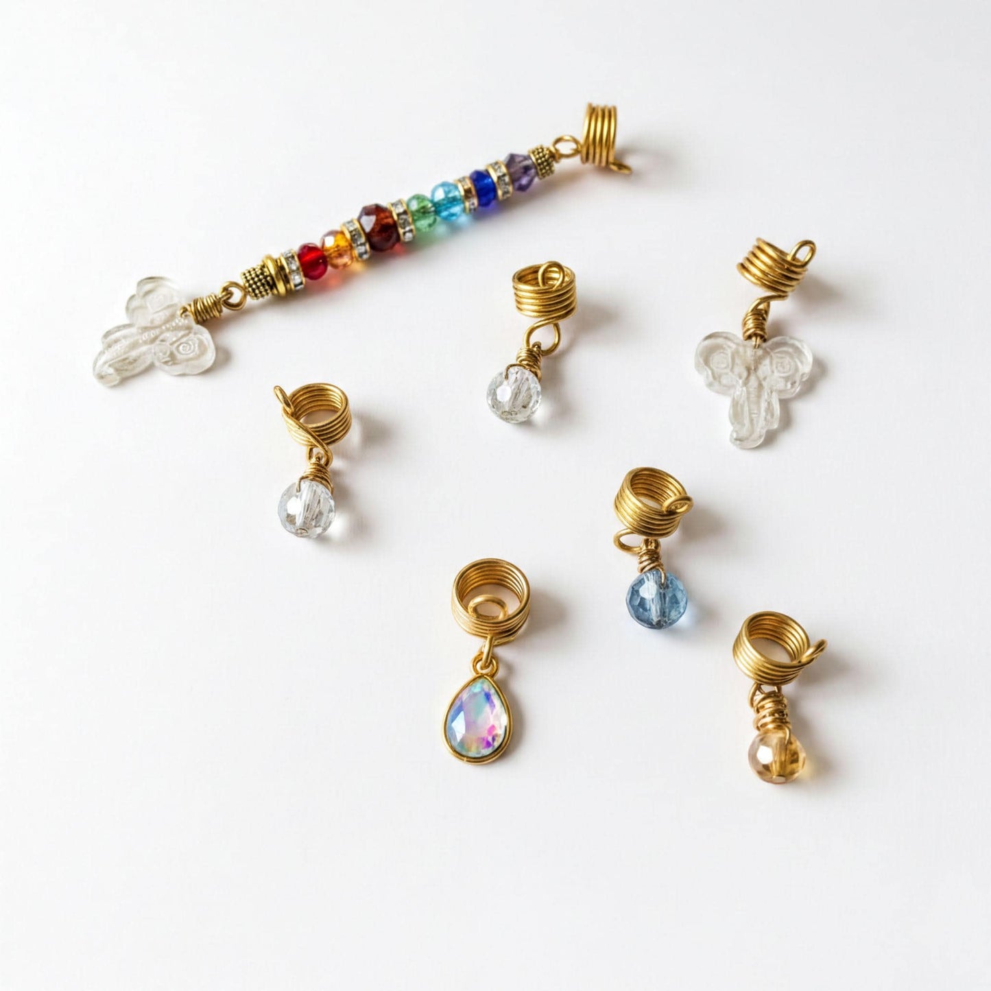 a collection of various jewelry pieces, including earrings and hair clips, arranged on a white background.