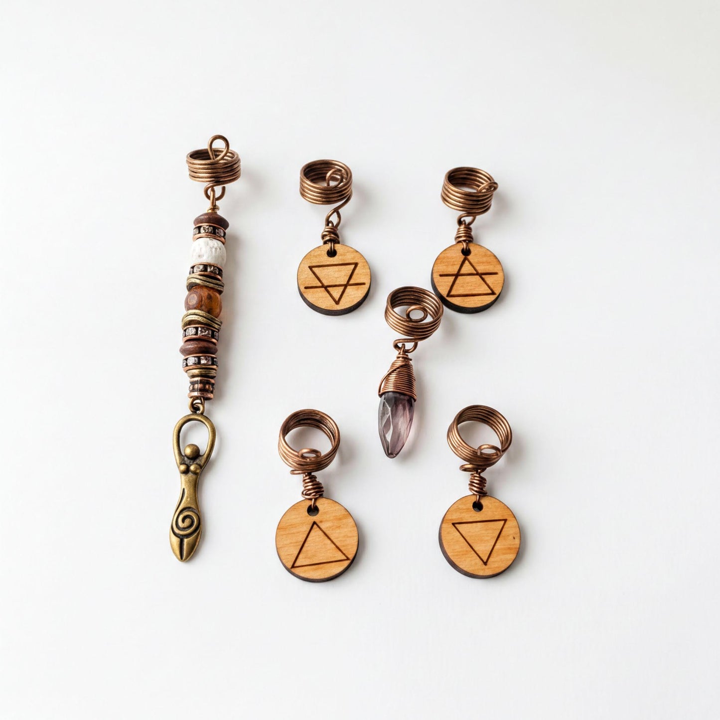 a collection of six wooden charms and five metal pendants, each with a unique design and symbol.