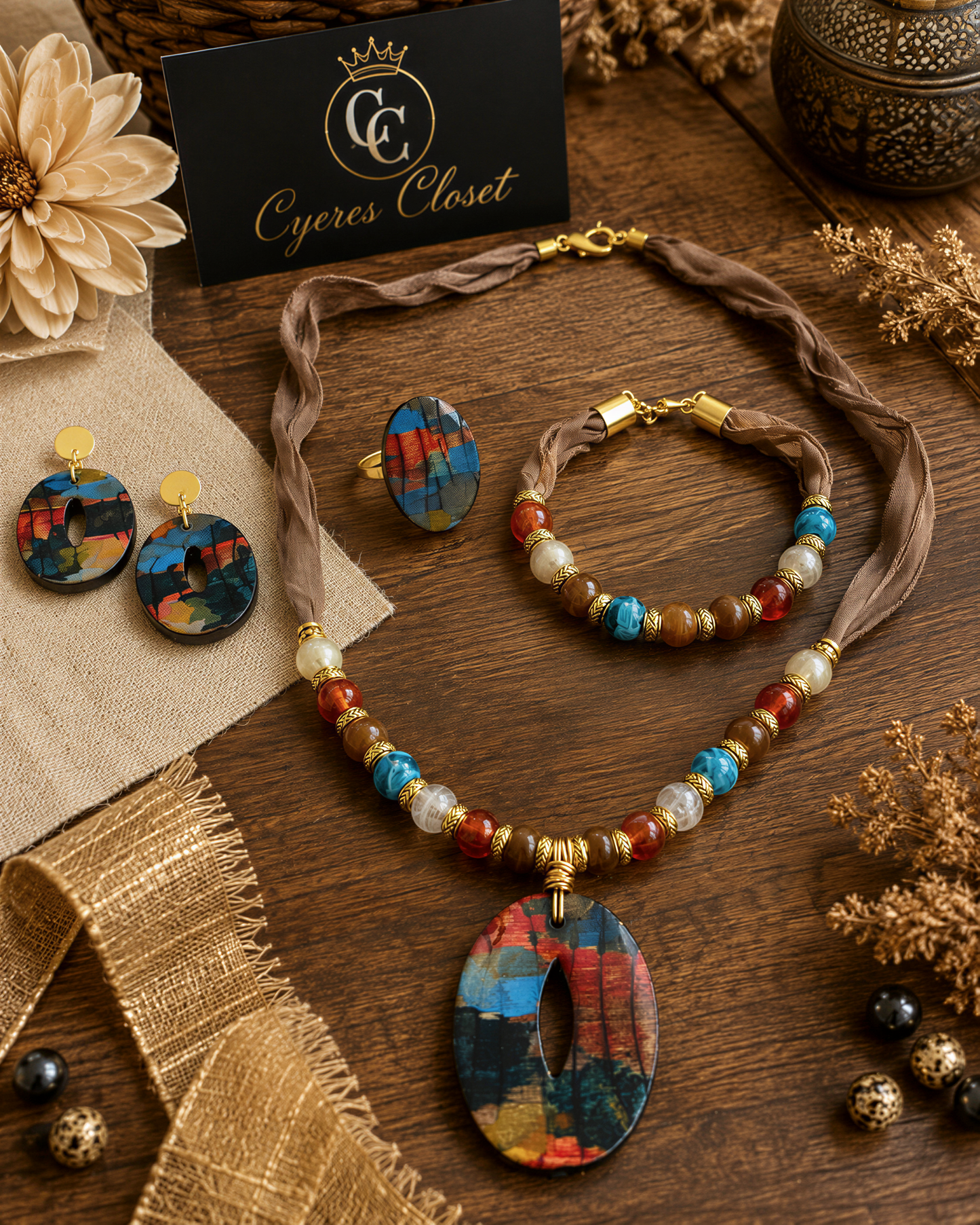 a collection of colorful and ornate jewelry and accessories, including a necklace, earrings, a bracelet, and a pendant, arranged on a wooden surface.