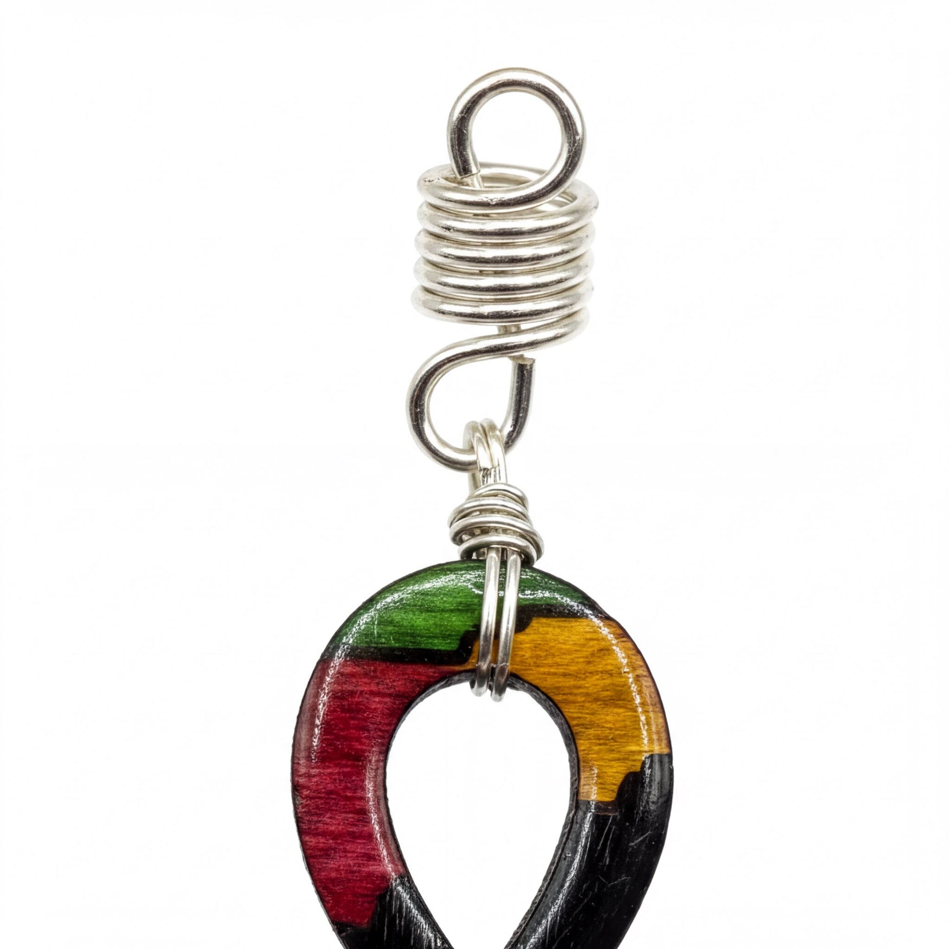 A colorful, multicolored wooden pendant with a metal spring attached to it.