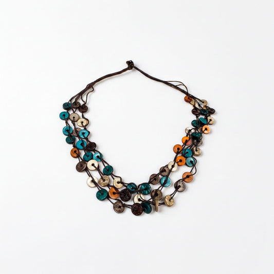 A colorful beaded necklace with various shades of blue, orange, and brown beads arranged in a layered design.