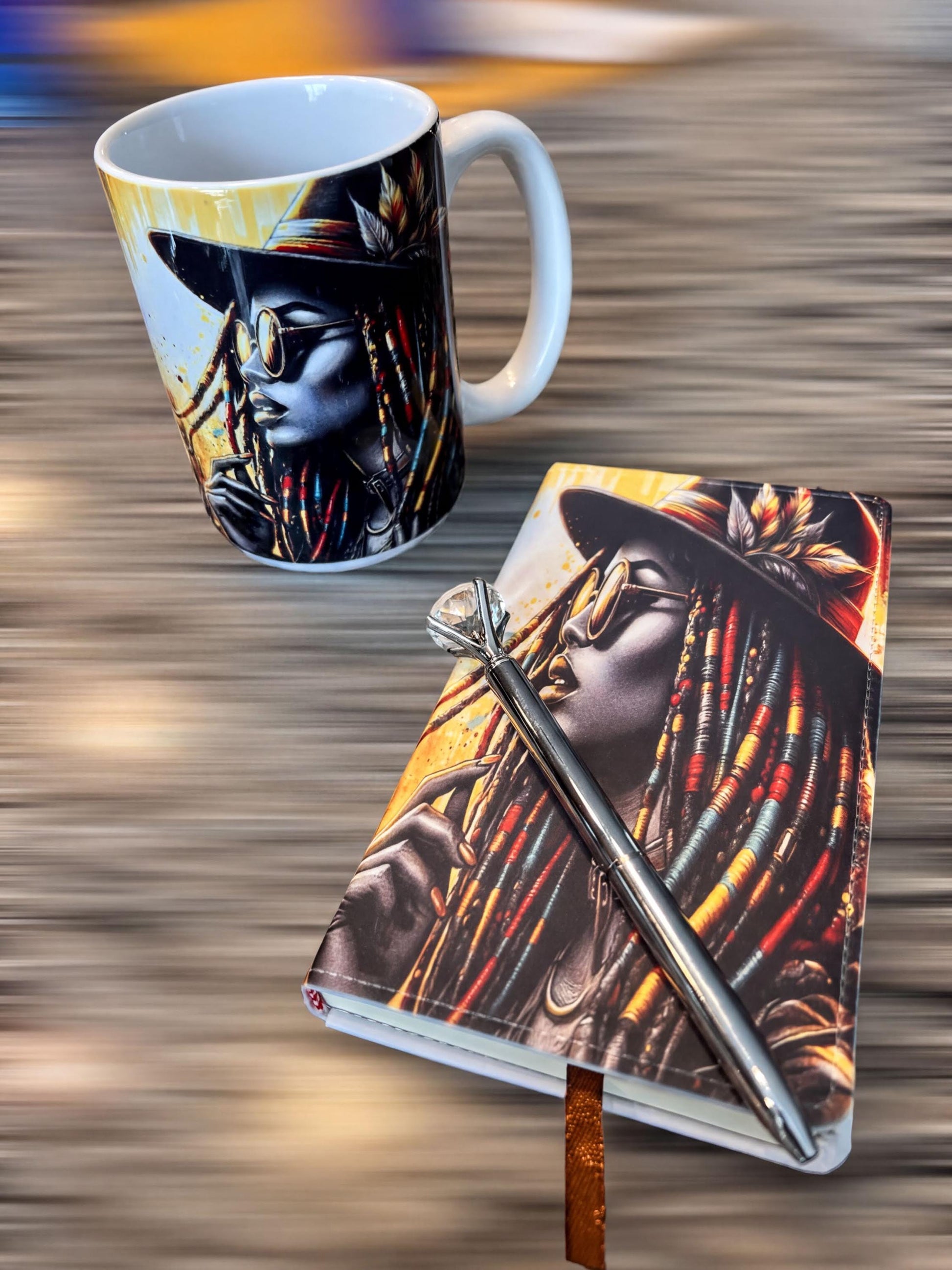 a white mug with a colorful design and a black and white notebook with a pen resting on it, both placed on a wooden surface.
