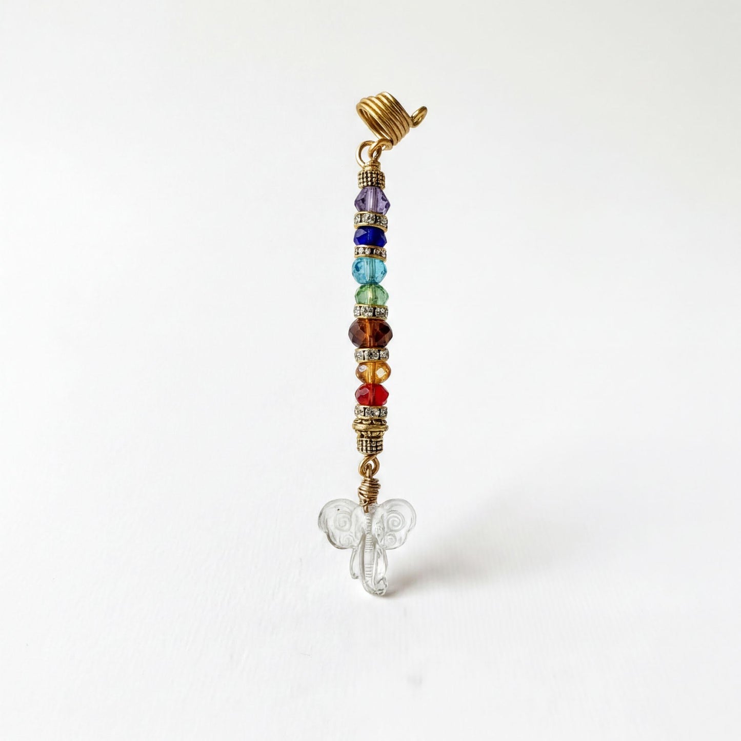 A colorful beaded charm with a butterfly design, featuring a gold-colored clasp and a clear glass butterfly at the bottom.