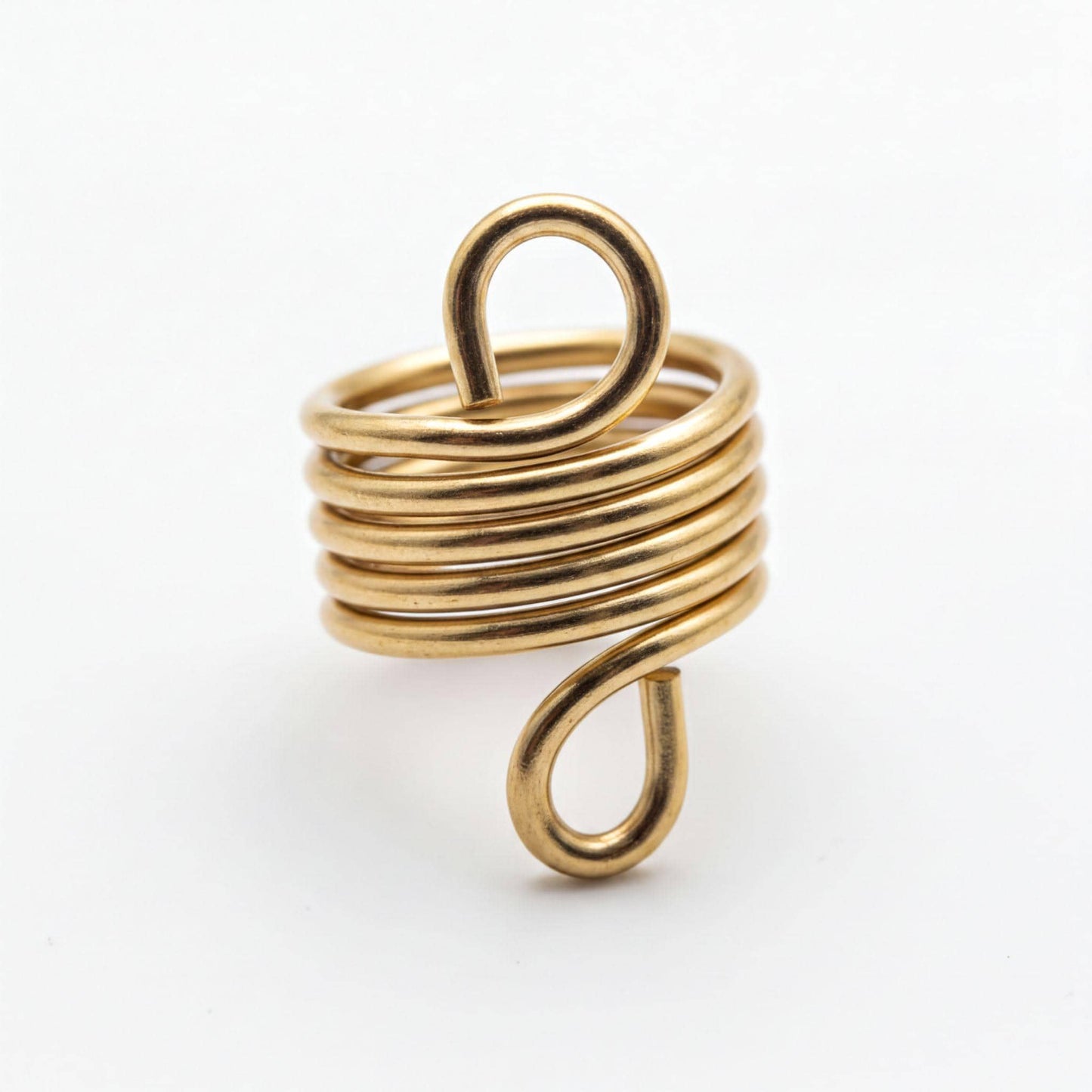 A gold-colored spiral ring with a twisted, coiled design.