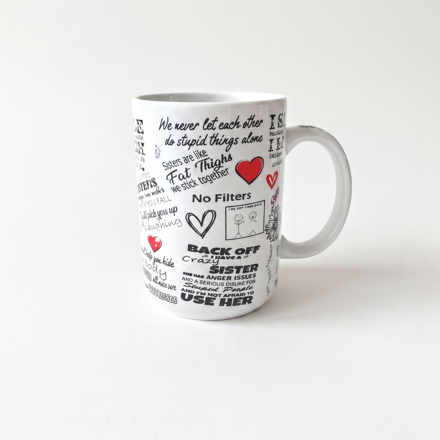a white mug with various phrases and illustrations printed on it, including words and symbols such as "We never let each other do stupid things alone", "No Filters", "Back off", "Sister", "Use her", and "Fat Thighs".